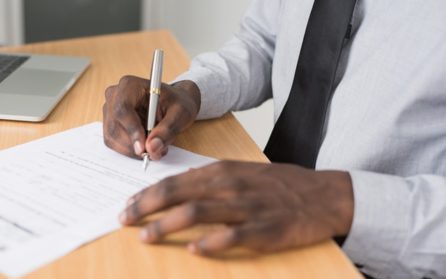 man completing canada border clearance paperwork